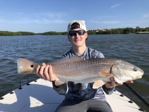 Holding a redfish