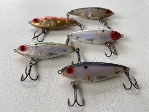 mirrodine xl lures laying on a boat.