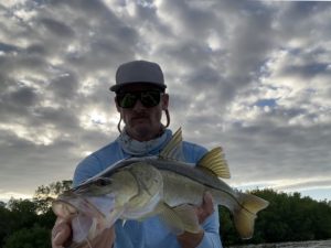 big topwater snook held by the author