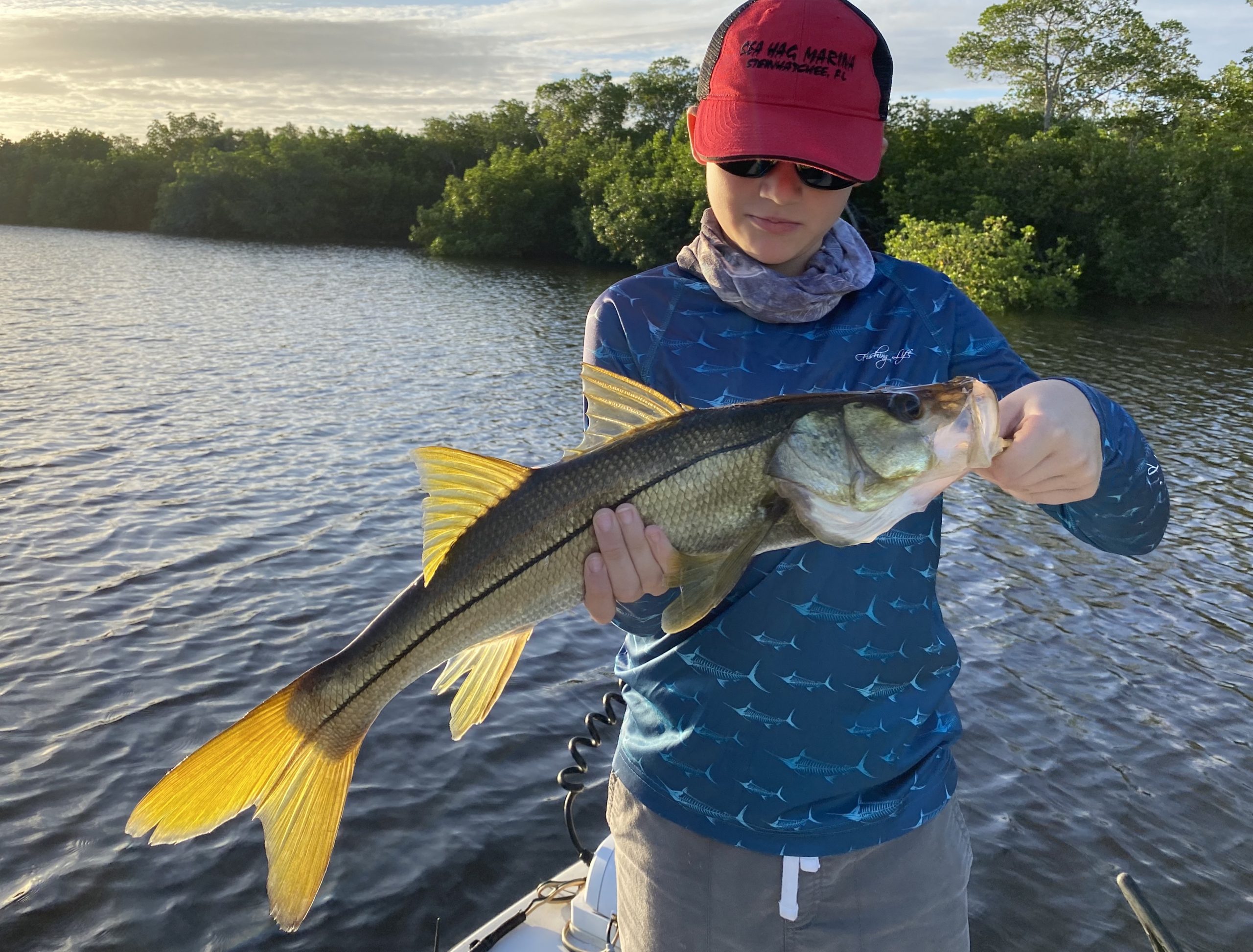 The author's son holds a snook