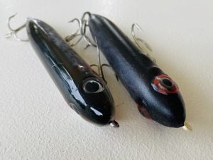 two topwater lures next to eachother
