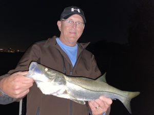 An angler holds a snook
