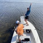 An angler celebrates a sight fishing success